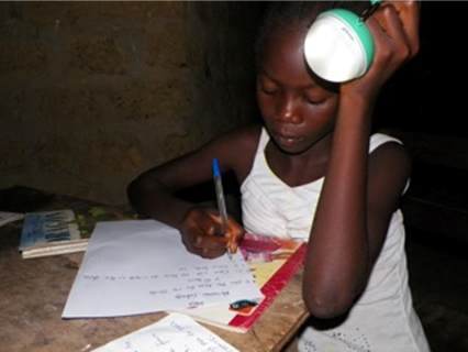 12-year old Amelia does her homework using a Nokero lantern ©Nokero International