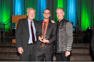 Sam Goldman (center) accepting his award at the National Peace Corps Association's The Promise of the Peace Corps Gala, surrounded by journalist Christ Matthews and NPCA President Kevin Quigley © NPCA