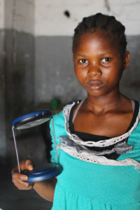 Customer under the Lighting Lives in Liberia program. Credit: World Bank / Inka Schomer 