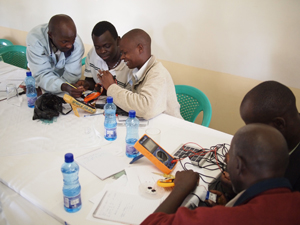 Technicians take apart some of the solar lanterns currently retailing on the Kenyan market during a recent training held in Kericho town, Kenya © Lighting Africa 