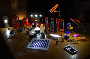 A researcher documents quality-assured solar lights on sale outside a shop in Kericho © Lighting Africa